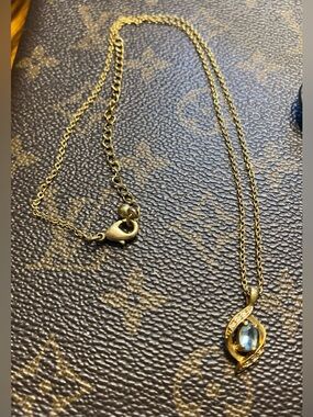 Vintage AVON Gold Tone Light Blue Rhinestone Swirl Pendant Necklace